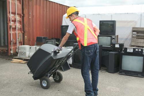 Workers wearing PPE during a commercial waste clearance